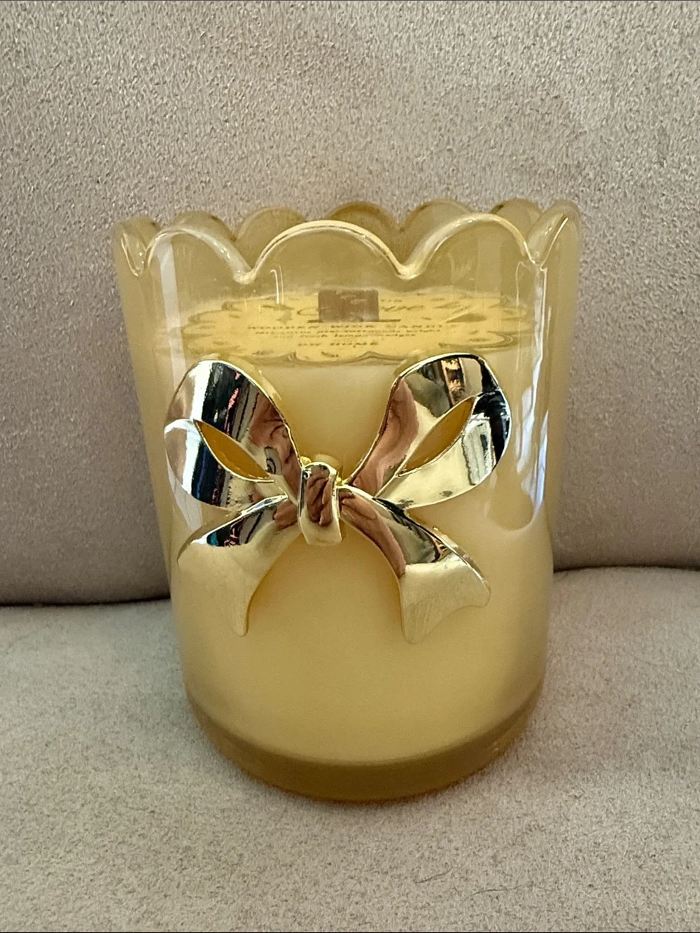 DW Home Yellow Scalloped Glass Wooden Wick Candle with a gold bow